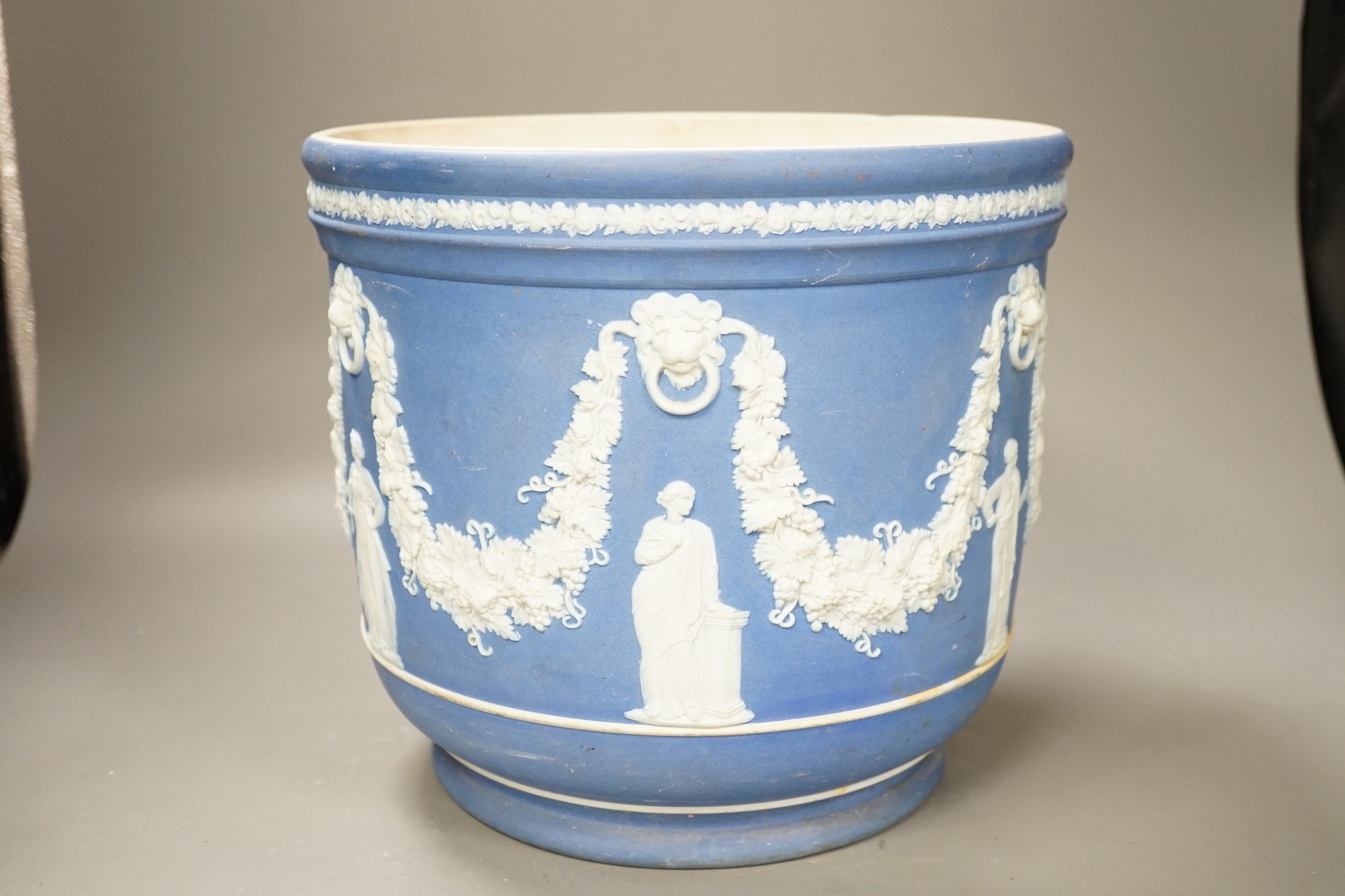 A Wedgwood blue jasper jardiniere, sprigged with muses and swags, height 23cm